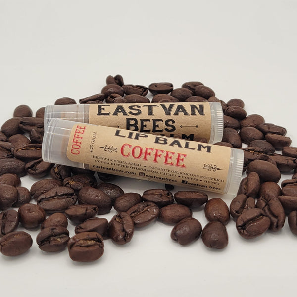 lip balm coffee flavour on a bed of coffee beans